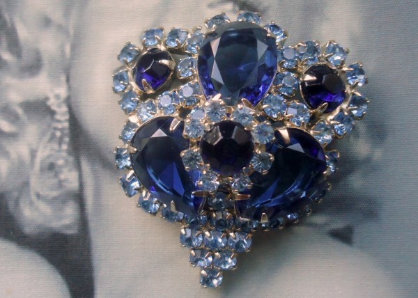 SOLD Unsigned Beauty. Sapphire Blue Open Back Teardrop and Chaton with Rosettes Brooch